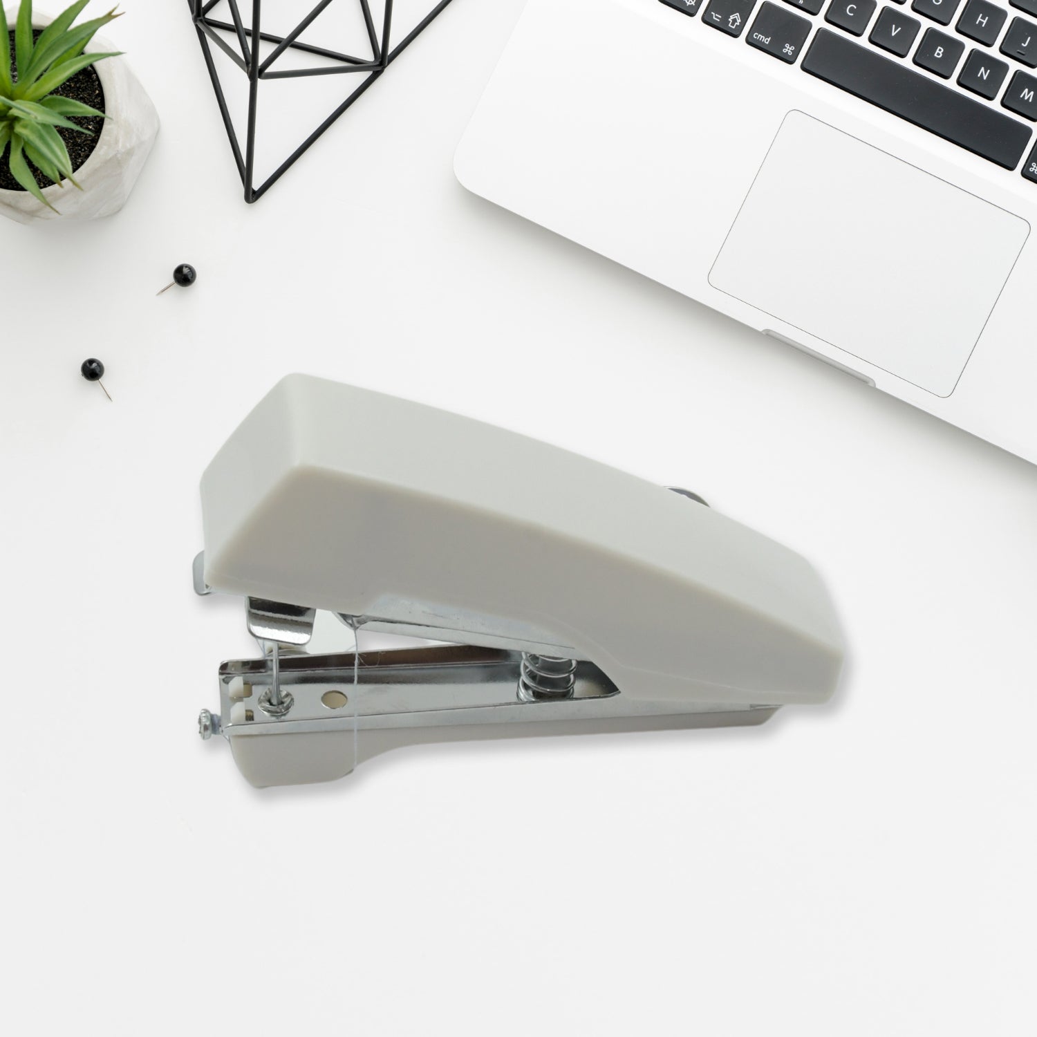 Pocket-sized manual sewing stapler