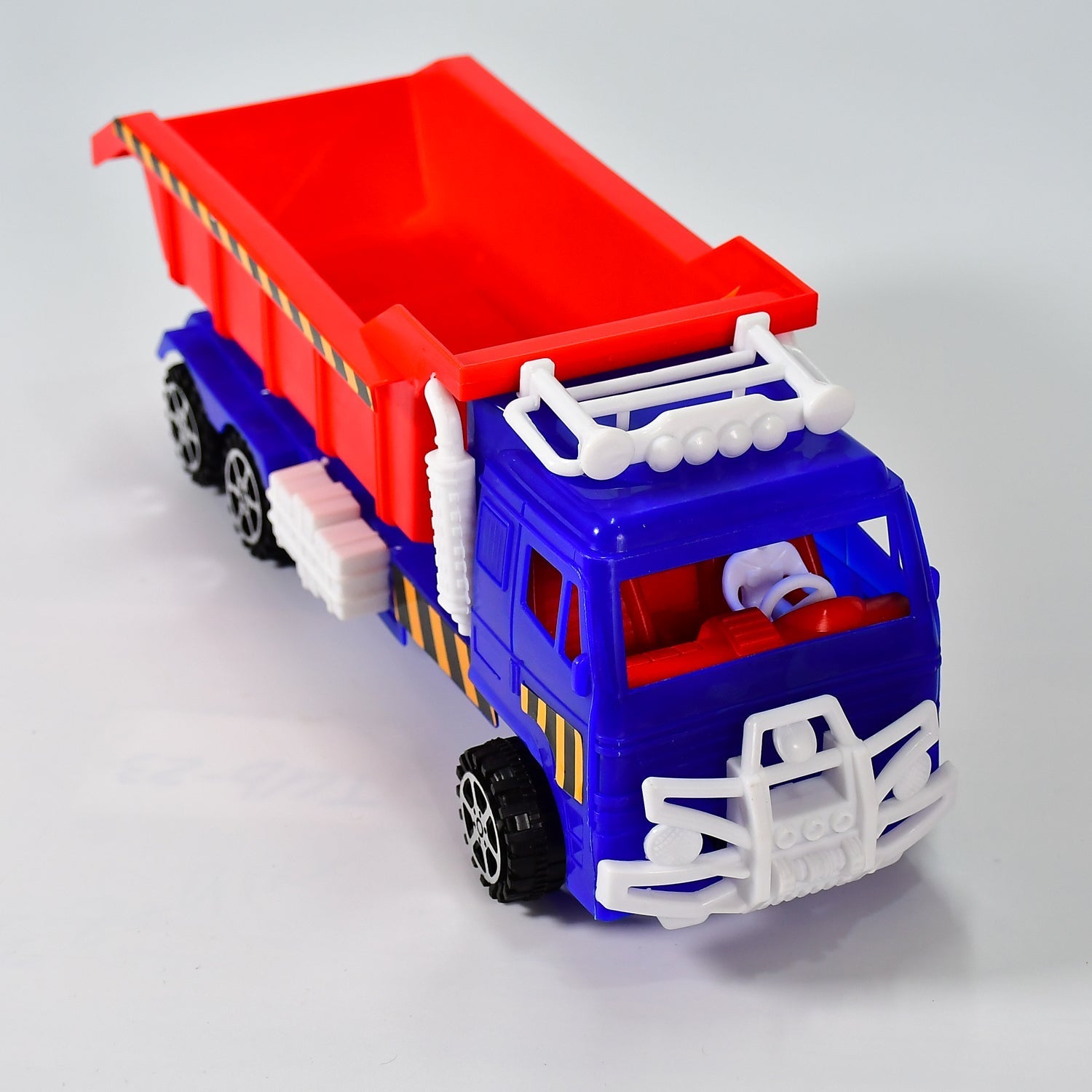 Truck toy with friction power feature