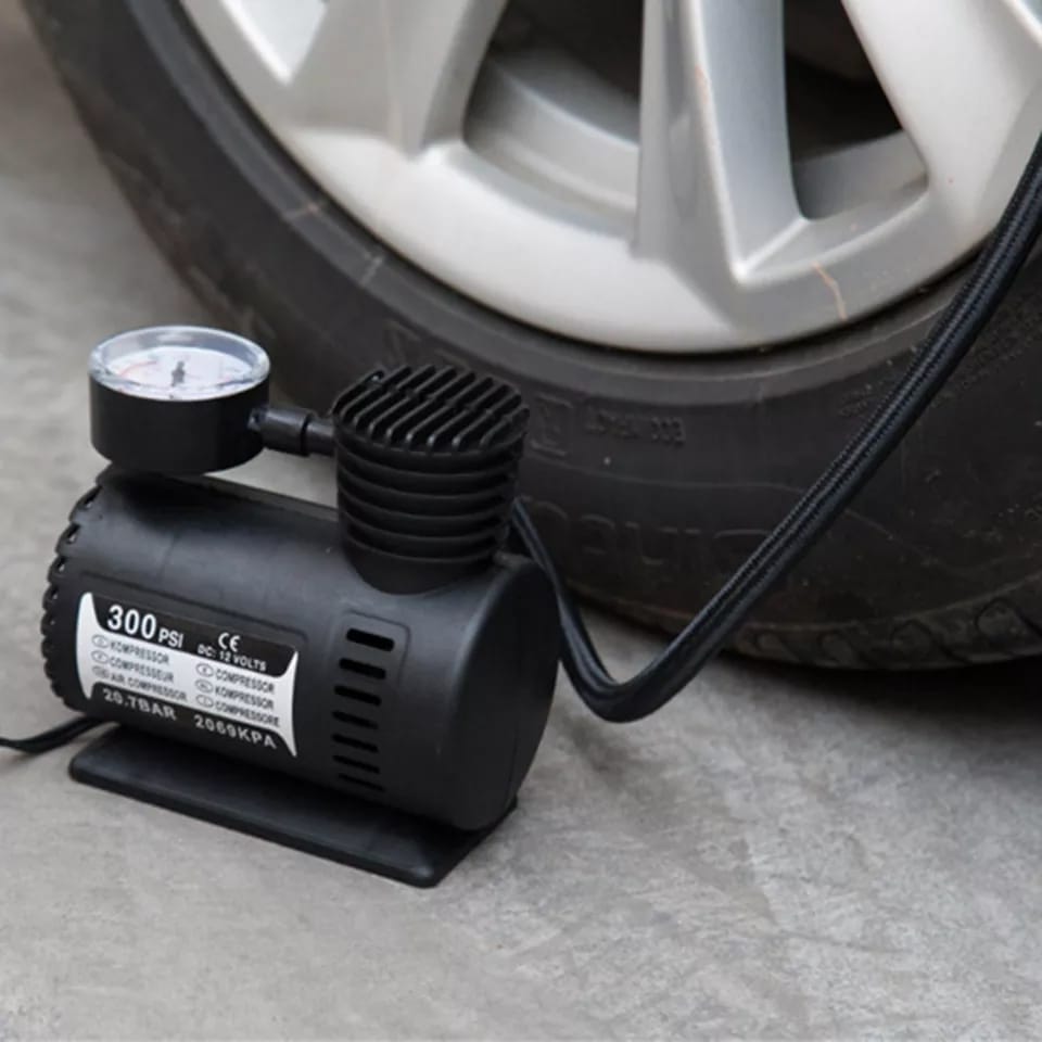 Portable air compressor with pressure gauge